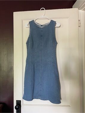 Sleeveless Light Blue Denim Dress. Pleated waist, zipper in back.